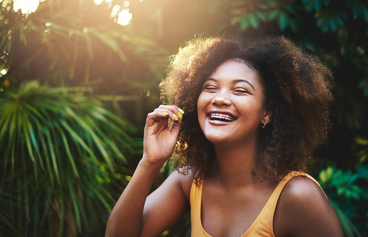 A smiling teen girl with braces from Brush & Floss Dental Center in Stratford, CT