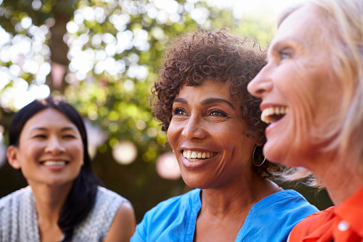 Group of older women with dental implants from Brush & Floss Dental Center in Stratford, CT