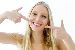 woman smiling with straight teeth from Brush & Floss Center in Stratford, CT