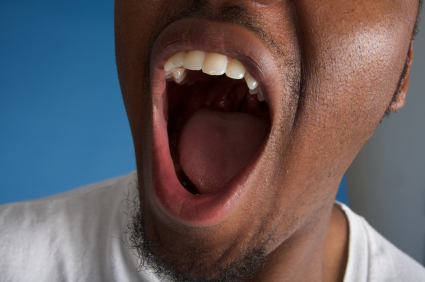 Smiling man with an open mouth.