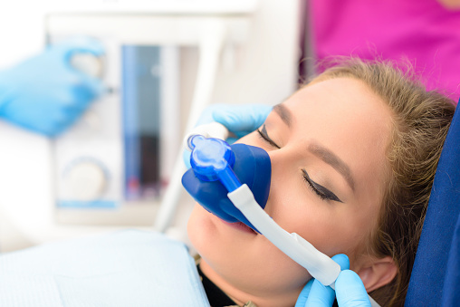 Image of a person being sedated inside a dental office, at Brush & Floss Dental Center in Stratford, CT.